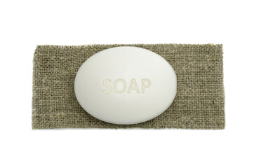 white facial soap, on a piece of burlap