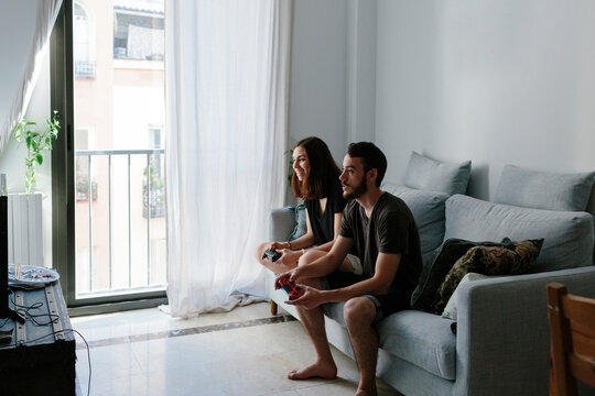 Young couple playing video game