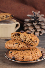 Oat cookies, a cup of coffee and coffee beans. Cozy mood.