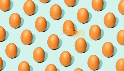 Seamless background of brown eggs placed in rows on white table in studio