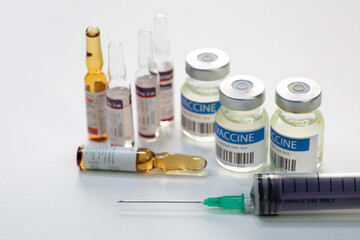 Medical syringe with vaccine bottles and injection vials used for treatment of patients