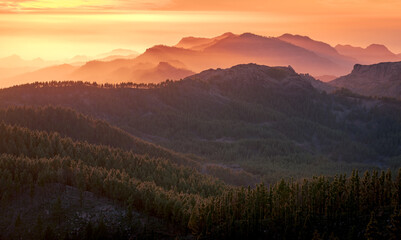 Magnificent view of mountain ridge under amazing sundown sky in evening in Gran Canaria