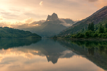 Breathtaking scenery of mountain ridge and calm lake in summer