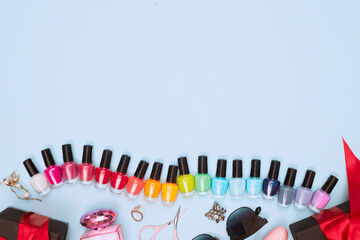 black friday concept, manicure with nail polish, pedicure on blue background, copy space, flat lay