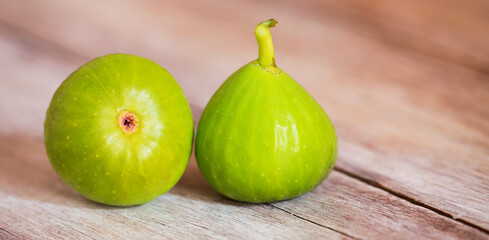 Fresh green fig fruits, healthy eating, food concept. Web banner with copy space.