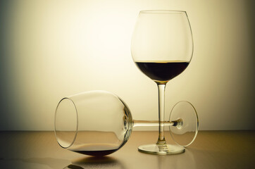 two glasses of alcohol taken on a warm background