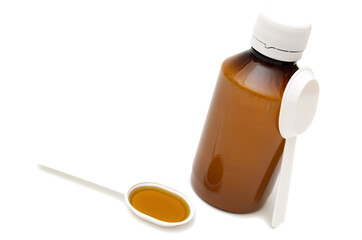 mixture and measuring spoon, .medicine bottle