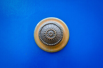 Ornate metal door knob with floral engraving
