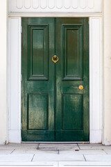 Elegant dark green wooden front door in London