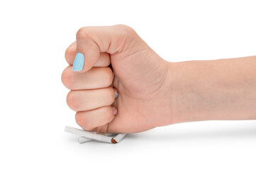 Stop smoking concept. Woman's fist breaks cigarettes on white background.