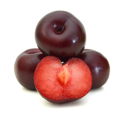 red plums isolated on white