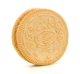 One vanilla sandwich cookie on white