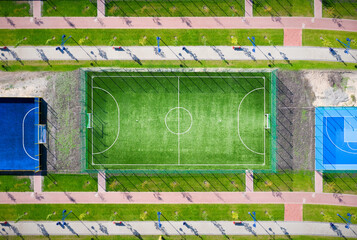 Aerial view of football field in a city park.