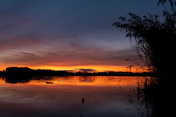 Fototapeta na wymiar Sunset over the pond Rezabinec near Pisek town, Southern Bohemia, Czech Republic