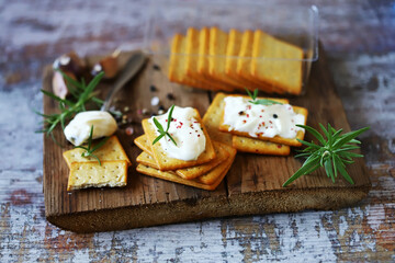Delicious garlic crackers with cream cheese. Junk food. Fast snack.