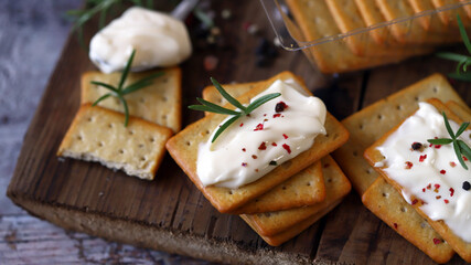 Delicious garlic crackers with cream cheese. Junk food. Fast snack.