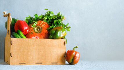 Wooden box full of vegetables. Copy space. Healthy organic food.
