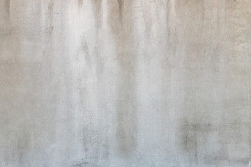 The texture of a concrete surface with traces of moisture. Wet concrete wall.