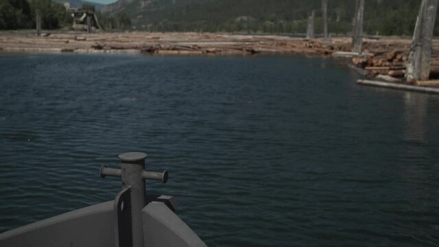 POV Bow of Ship Sailing Towards Log Boom