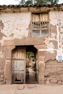 An entray way arch and   balcony to a home along the main street in Yucay, Peru