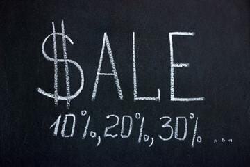 
Chalk board inscription SALE with dollar sign, discount percentages 10,20,30 and dots