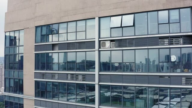City reflections in office building