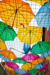 Fototapeta na wymiar Funny colorful umbrella decoration photographed from below.