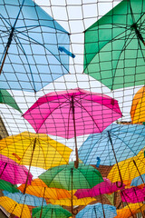 Funny colorful umbrella decoration photographed from below.