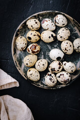 Fresh quail eggs on dark background