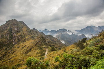 Fototapeta premium Early morning at Macchu Picchu camp on the Inca trail, looking at the surrounding mountains, Peru.