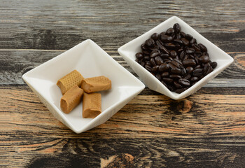 Cafe con leche coffee toffee candy and coffee beans in white candy bowls 