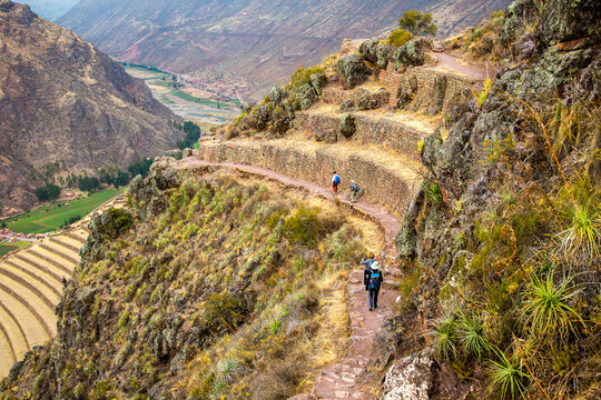Pisac, Peru - 11/1/2015:  Hikers on the Inca trail, passing by the Parque Archaeology site (Inca ruins)  near Pisac,.
