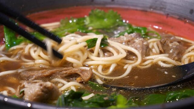 chinese famous street food soup with chopsticks close up slow motion panorama 4k china