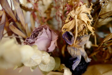 Bouquet of dried purple, pink, and greens with close-up on lavender rose.
