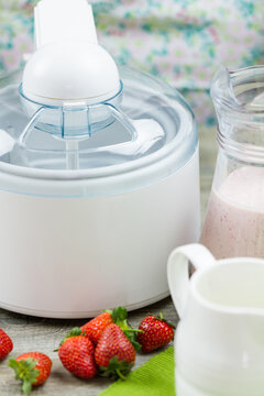 Ice cream maker machine making strawberry ice cream