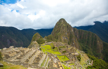 View Macchu Picchu with a cloud bank in the background, Peru.