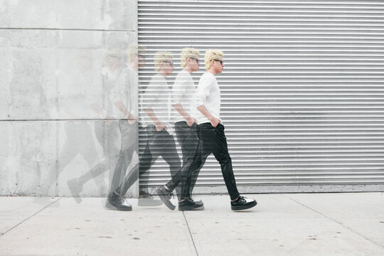 Young Hispanic/Latino Man in Fashion Walking in Industrial Space