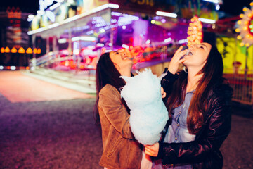 Two girls having fun at carnival