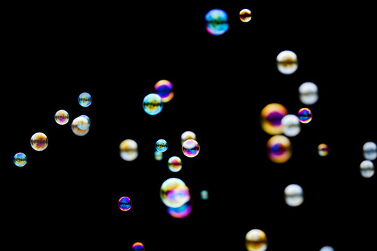 Soap bubbles on dark background