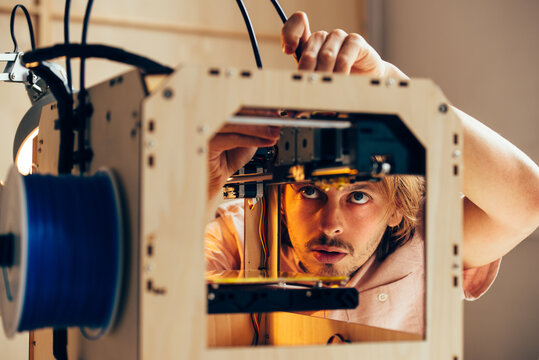 Technician working with 3D printer