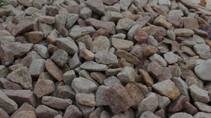 Many rocks on the ground. Good for a background or wallpaper.