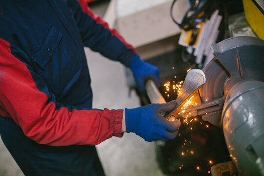 Man sharpen an ax