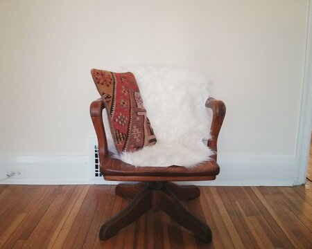 Patterned Kilim Pillow on antique wood chair