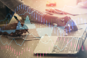 Double exposure of businesswoman hands typing on computer and forex chart hologram drawing. Financial analysis concept.