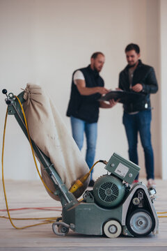 Contractor discusses work of renovation and overhaul with client