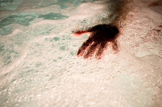 Hand in bubbles
