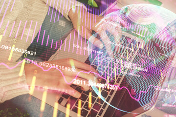 Double exposure of woman hands typing on computer and forex chart hologram drawing. Stock market invest concept.