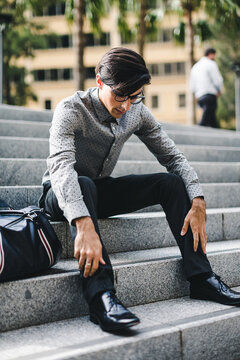Pensive Businessman sitting outdoor