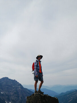 Male hiker standing on mountain summit