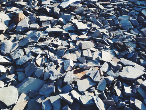 Close up various scattered rocks on mountain summit
